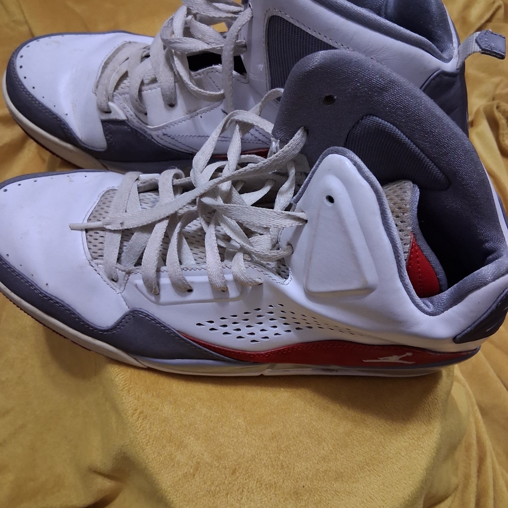 Jordan White and Gray Athletic Shoes with Red Accents